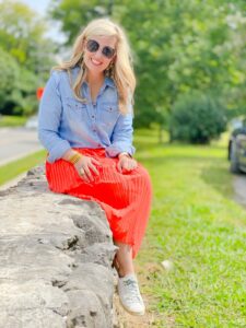 denim top with orange maxi and sneakers