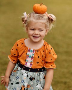 little girl wearing Halloween outfit from Matilda Jane